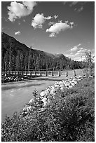 Suspension bridge crossing the Vermillion River. Kootenay National Park, Canadian Rockies, British Columbia, Canada (black and white)