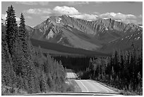 Kootenay Parkway highway and mountains, afternoon. Kootenay National Park, Canadian Rockies, British Columbia, Canada ( black and white)