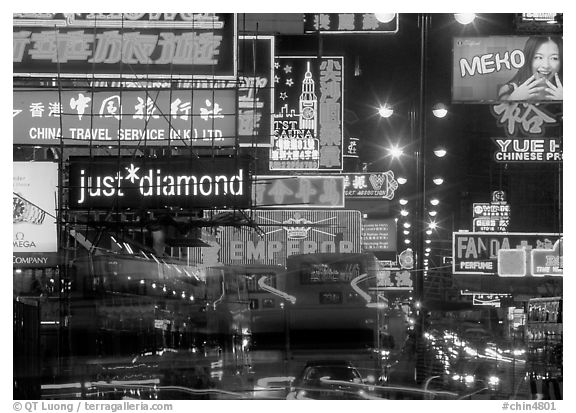 Nathan road, brilliantly lit by neon lights at night, Kowloon. Hong-Kong, China