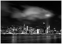 Hong-Kong Island skyline from the waterfront promenade by night. Hong-Kong, China ( black and white)