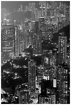 Residential towers on steep hillside from Victoria Peak by night. Hong-Kong, China (black and white)