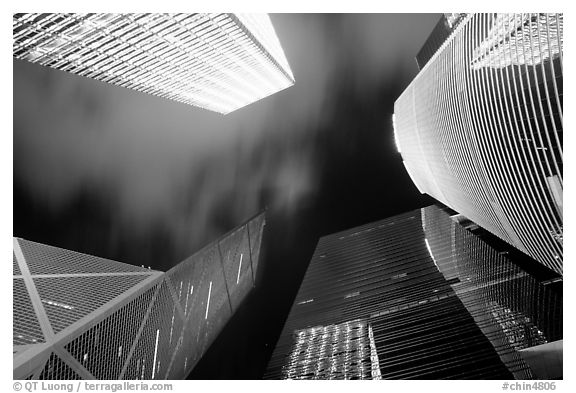 Looking up from plaza with Bank of China and Cheung Kong Center buildings by night. Hong-Kong, China