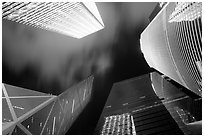 Looking up from plaza with Bank of China and Cheung Kong Center buildings by night. Hong-Kong, China (black and white)