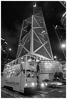 Old tram and Bank of China building (369m), designed by Pei, by night. Hong-Kong, China (black and white)