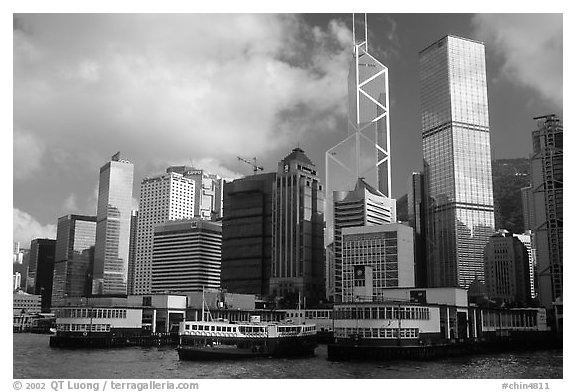 Star ferry leaves Hong-Kong island. Symmetrical shape alleviates need for turning around. Hong-Kong, China (black and white)