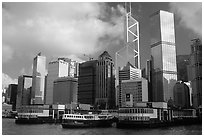 Star ferry leaves Hong-Kong island. Symmetrical shape alleviates need for turning around. Hong-Kong, China (black and white)