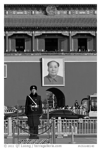 Guard in winter uniform and Mao Zedong picture, Tiananmen Square. Beijing, China (black and white)