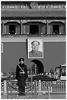 Guard in winter uniform and Mao Zedong picture, Tiananmen Square. Beijing, China ( black and white)