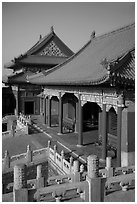 Pavilion with red columns and yellow roof tiles typical of imperial architecture, Forbidden City. Beijing, China (black and white)