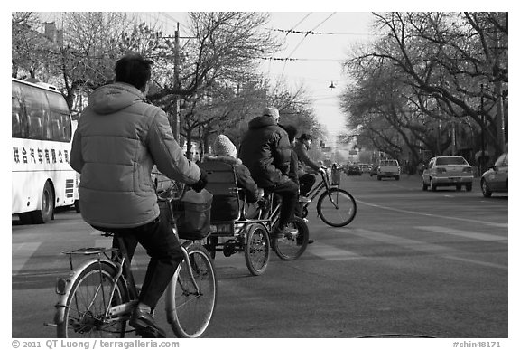 Bicyles and cyclo on street. Beijing, China (black and white)