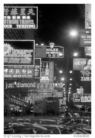 Nathan road, brilliantly lit by neon lights at night, Kowloon. Hong-Kong, China (black and white)