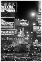 Nathan road, brilliantly lit by neon lights at night, Kowloon. Hong-Kong, China (black and white)