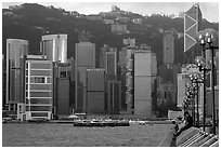 Skycrapers of Hong-Kong Island seen from the Promenade, early morning. Hong-Kong, China (black and white)