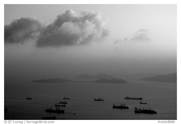 Cargo ships anchored outside of the harbor. Hong-Kong, China (black and white)