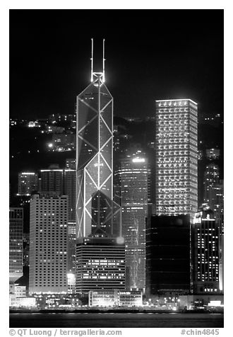 Bank of China (369m) and Cheung Kong Center (290m) buildings  across  harbor by night. Hong-Kong, China