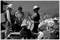 Bai women wearing tribespeople dress at the Monday market. Shaping, Yunnan, China (black and white)