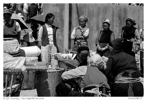 Women of the Bai tribe selling incense. Shaping, Yunnan, China