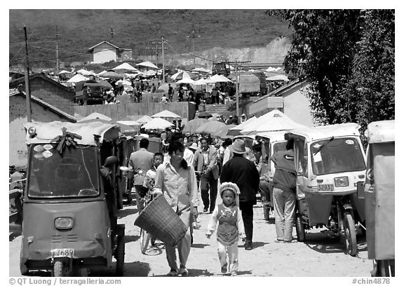 Tuk-tuk waiting for villagers ouside the Monday market. Shaping, Yunnan, China