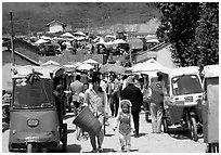 Tuk-tuk waiting for villagers ouside the Monday market. Shaping, Yunnan, China (black and white)