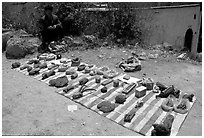 Selling strange items. Shaping, Yunnan, China ( black and white)