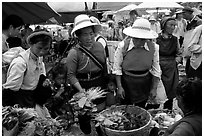 Bai women buying vegetables at the Monday market. Shaping, Yunnan, China ( black and white)
