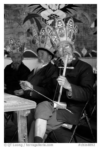 Elderly musician Playing the traditional two-stringed Ehru. Baisha, Yunnan, China (black and white)