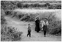 Women returning from the fields. Baisha, Yunnan, China (black and white)