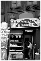 Store owned by a woman of the Muslim community. Kunming, Yunnan, China (black and white)