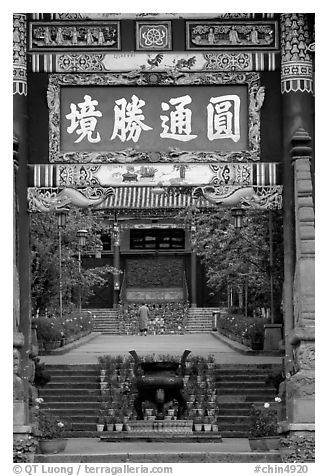 Monk on entrance alley of Yantong Si. Kunming, Yunnan, China