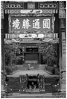 Monk on entrance alley of Yantong Si. Kunming, Yunnan, China (black and white)