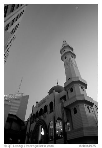 Nancheng Mosque built recently, a hybrid of white-tiled high rise with a mosque's green onion domes. Kunming, Yunnan, China