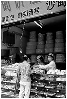 Women at Muslim pastry store. Kunming, Yunnan, China ( black and white)