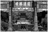 Woman and girl on entrance alley of Yantong Si. Kunming, Yunnan, China ( black and white)