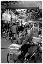 Street vendor in an old alley. Kunming, Yunnan, China (black and white)