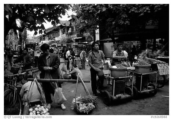 Street food vendors in an old alley. Kunming, Yunnan, China