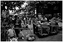 Street food vendors in an old alley. Kunming, Yunnan, China (black and white)