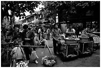 Street food vendors in an old alley. Kunming, Yunnan, China ( black and white)