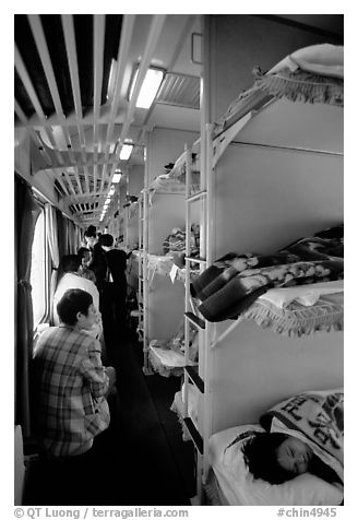 Inside a hard sleeper car train.  (black and white)