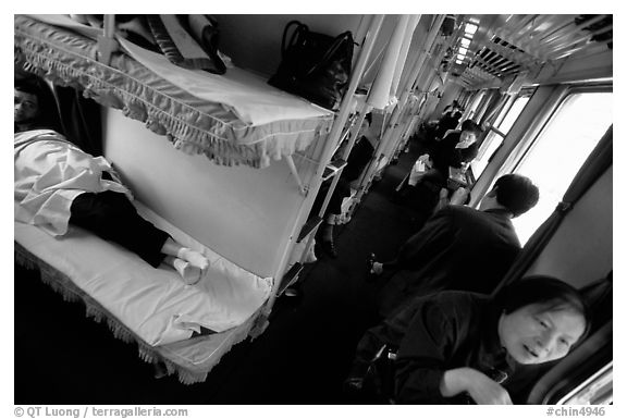 Inside a hard sleeper car train.  (black and white)