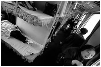 Inside a hard sleeper car train. (black and white)