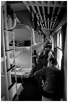 Inside a hard sleeper car train.  ( black and white)