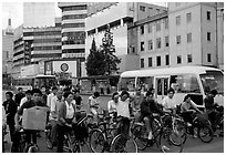 Bicyclists waiting for traffic light. Kunming, Yunnan, China (black and white)