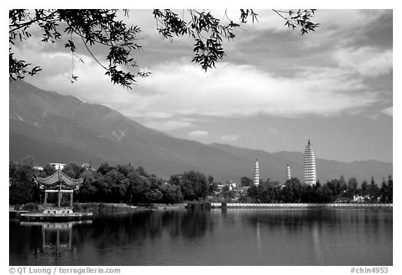 San Ta Si (Three pagodas) reflected in a lake, early morning. Dali, Yunnan, China (black and white)