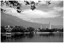 San Ta Si (Three pagodas) reflected in a lake, early morning. Dali, Yunnan, China ( black and white)