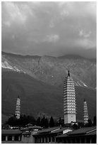 San Ta Si (Three pagodas) at sunrise with Cang Shan mountains in the background. Dali, Yunnan, China (black and white)