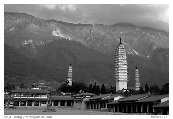 San Ta Si (Three pagodas) at sunrise with Cang Shan mountains in the background. Dali, Yunnan, China (black and white)