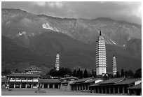 San Ta Si (Three pagodas) at sunrise with Cang Shan mountains in the background. Dali, Yunnan, China (black and white)