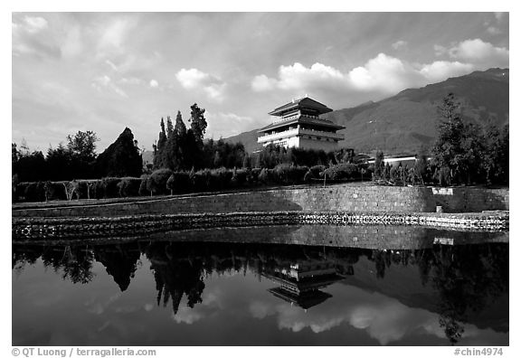 Chong-sheng Si, temple behind the Three Pagodas, reflected in a pond. Dali, Yunnan, China (black and white)