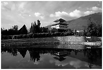 Chong-sheng Si, temple behind the Three Pagodas, reflected in a pond. Dali, Yunnan, China (black and white)