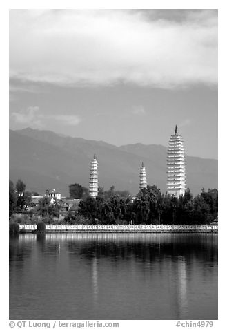 San Ta Si (Three pagodas) reflected in a lake, early morning. Dali, Yunnan, China (black and white)
